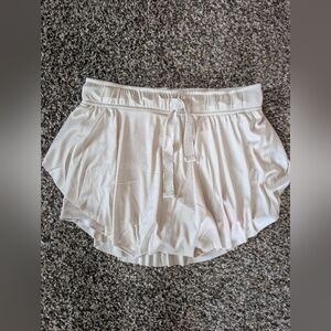 Zenana Outfitters Cream Colored Ruffle Hem Athletic Shorts